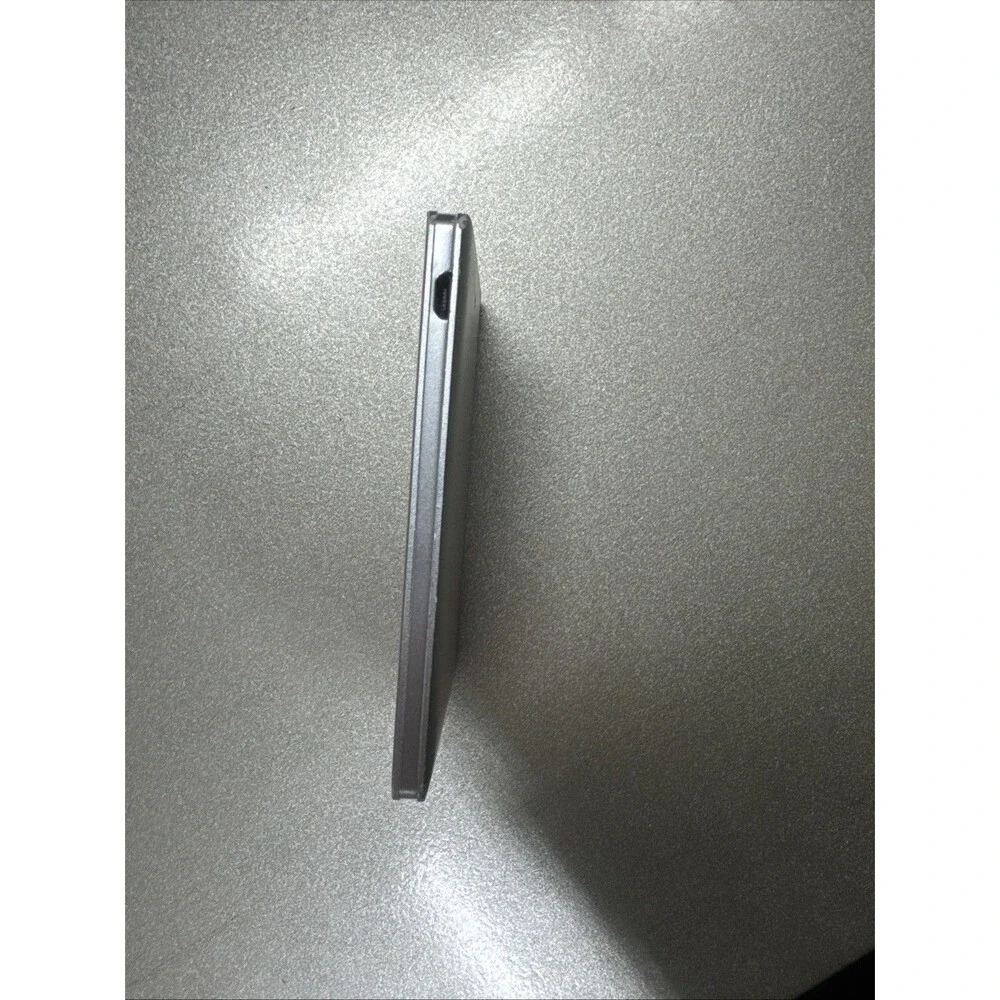 Ultra Slim portable charger silver with looks like Micro-USB cord see photos